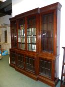 AN EDWARDIAN GEO.III.STYLE MAHOGANY BREAKFRONT BOOKCASE WITH FOUR GLAZED DOORS TO BOTH UPPER AND