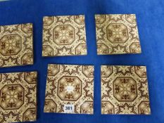 A SET OF EIGHT TILES PRINTED IN BROWN WITH AESTHETIC STYLE GEOMETRIC FLORAL DESIGNS, ONE WITH