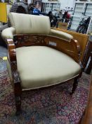 A PAIR OF EDWARDIAN MAHOGANY ELBOW CHAIRS, THE UNUPHOLSTEREDARM RESTS RUNNING INTO BACKS SWEEPING