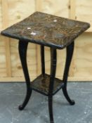 A JAPANESE EBONISED TABLE, THE TWO TIERS CARVED WITH CHRYSANTHEMUMS BETWEEN CABRIOLE LEGS. W.45 x