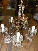 A GILT METAL FIVE LIGHT CHANDELIER WITH LUSTRED GLASS DRIP PANS. H.48cms.
