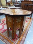 AN ISLAMIC OCTAGONAL TABLE, THE HINGED TOP INLAID GEOMETRICALLY IN MOTHER OF PEARL, EBONY AND