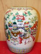 A 19th C. CHINESE FAMILLE ROSE TALL JAR PAINTED WITH VASES AND FLOWERS. H 29.5cms.