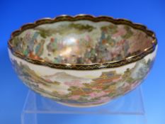 KOZAN. A SATSUMA BOWL PAINTED WITH A CROWD OF FIGURES ADMIRING CHERRY BLOSSOMS OUTSIDE A TEMPLE,