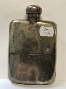 AN EDWARDIAN SILVER HALLMARKED HIP FLASK WITH GILDED INNER AND REMOVABLE BOTTOM CUP WITH HINGED