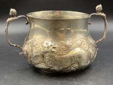 A BRITANNIA STANDARD SILVER PORRINGER, WITH REPOUSSE DECORATION BEARING A UNICORN, LION AND FLORAL