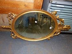 A 19th.C.OVAL MIRROR WITH GILT FOLIATE CREST AND BASE. 104 x 52cms.
