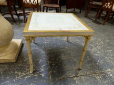 A GILT AND WHITE PAINTED COFFEE TABLE, THE TOP GLAZED OVER A ROUNDEL OF FLOWERS PAINTED ONTO A WHITE