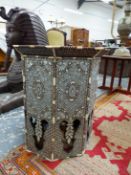 AN ISLAMIC OCTAGONAL TABLE INLAID IN BONE AND MOTHER OF PEARL WITH FLOWER HEADS ON A DIAMOND