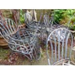 A SET OF EIGHT WROUGHT IRON PATIO CHAIRS WITH LATTICE SEATS. (8)