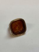 A YELLOW METAL DOUBLE SIDED CARVED INTAGLIO RING. GROSS WEIGHT 7.9grms.