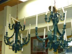 A PAIR OF ELEVEN LIGHT ROCOCO STYLE CHANDELIERS WITH SCROLL FOLIATE DECORATED BRANCHES. H.80cms. (