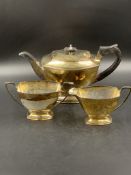 A THREE PART SILVER HALLMARKED TEA SET FOR JOHN TURTON & Co, DATED 1962. GROSS WEIGHT 1071grms.