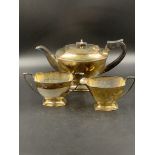 A THREE PART SILVER HALLMARKED TEA SET FOR JOHN TURTON & Co, DATED 1962. GROSS WEIGHT 1071grms.