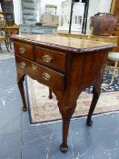 A 19th.C. WALNUT LOW BOY, THE CROSS BANDED TOP OVER TWO SHORT AND A LONG DRAWER ON CABRIOLE LEGS