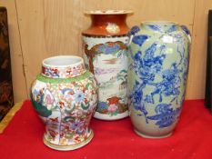 A JAPANESE KUTANI CYLINDRICAL VASE PAINTED WITH A FRAMED LANSCAPE AND A PHEASANT AMONGST CHERRY