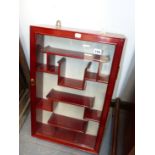 A CARVED ORIENTAL HARDWOOD SMALL GLAZED HANGING DISPLAY CABINET. 64 x 41cms.