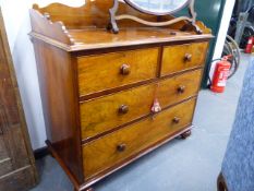 A WALNUT DRESSING CHEST WITH THREE QUARTER GALLERY OVER TWO SHORT AND TWO LONG DRAWERS ON BUN