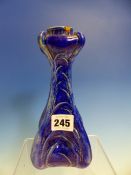 A MARTIN BROTHERS BLUE GLAZED VEGETABLE FORM CANDLESTICK DATED 1902,THE SQUARE SECTIONED BODY