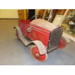 A RARE LATE 1920'S/EARLY 30'S TIN PLATE PEDAL CAR WITH SINGLE SIDE DOOR AND BEARING A LITHOGRAPHIC