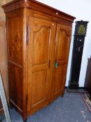 A FRENCH PROVINCIAL CARVED AND INLAID WALNUT AND FRUITWOOD ARMOIRE WITH TWIN PANEL DOORS. H.192 x
