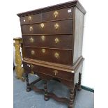 AN 18th.C.OAK CHEST ON STAND WITH TWO SHORT AND THREE LONG GRADUATED DRAWERS OVER A DEEP SINGLE