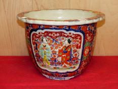 A JAPANESE IMARI PLANTER , THE FLORAL FLAT RIM OVER RELIEF MOULDED AND OTHER FIGURE RESERVES ON