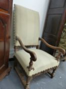 AN ANTIQUE FLEMISH WALNUT HIGH BACK OPEN ARMCHAIR ON TURNED SUPPORTS UNITED BY STRETCHERS. W.64 x