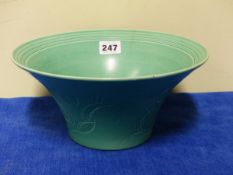 A SUSIE COOPER GREEN GLAZED BOWL, THE FLARED SIDES OF THE EXTERIOR INCISED WITH THREE SQUIRRELS.