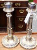 A PAIR OF OLD SHEFFIELD PLATE CANDLESTICKS WITH GLASS SHADES, THE FOLIATE COLUMNS OF QUATREFOIL