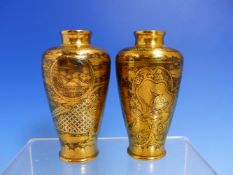 A PAIR OF JAPANESE BLACK METAL GROUND VASES INLAID IN KOMAI STYLE IN GOLD AND SILVER WITH DRAGON