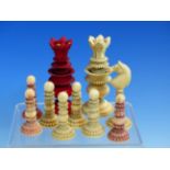 ELEVEN INDIAN IVORY CHESS PIECES CARVED WITH FINELY DETAILED FOLIAGE BANDS, FIVE STAINED RED, THE