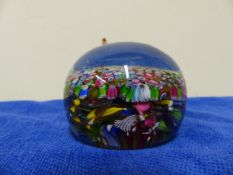 A VENETIAN GLASS MILLEFIORE PAPER WEIGHT. Dia 7.5cms.