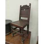 A PAIR OF ANTIQUE OAK CHAIRS WITH WAVY TOP RAILS ABOVE PANELLED BACKS, A LATE 17th.C. OAK CHAIR WITH