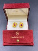 ILIAS LALAOUNIS, A PAIR OF 18ct YELLOW GOLD CABOCHON RUBY CLIP ON EARRINGS COMPLETE WITH BRANDED