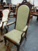 A VICTORAIN ROSEWOOD ELBOW CHAIR, THE ROUND ARCHED FRAME TO THE UPHOLSTERED BACK CRESTED BY