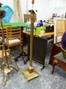 A BRASS CORINTHIUM COLUMN STANDARD LAMP ON STEPPED SQUARE PLINTH AND FOUR PAW FEET. H.138cms.