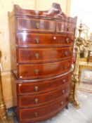 AN EARLY 19th.C. MAHOGANY BOW FRONTED CHEST ON CHEST, THE TWO SHORT AND SIX LONG DRAWERS SATINWOOD