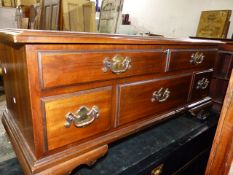 AN AMERICAN CEDAR LOW CHEST BY LANE FURNISHINGS WITH RISING TOP SHAPED BRACKET FEET. W.112 x