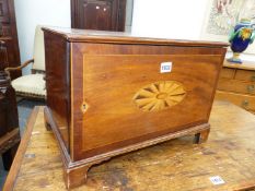 AN ANTIQUE MAHOGANY COLLECTOR'S CABINET, THE DOOR INLAID WITH AN OVAL PATERA ABOVE BRACKET FEET