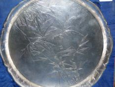 'TACKHING STERLING', A TRIPOD SALVER CHASED WITH BAMBOO ON A HAMMERED GROUND, PRESENTATION