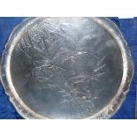 'TACKHING STERLING', A TRIPOD SALVER CHASED WITH BAMBOO ON A HAMMERED GROUND, PRESENTATION