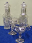 A PAIR OF WATERFORD DECANTERS TOGETHER WITH A PAIR STANDING BOWLS WITH EVERTED CASTELLATED RIMS,