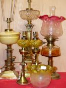 A PAIR OF OIL LAMPS, THREE OTHERS AND TWO SHADES, ALL BUT ONE LAMP CONVERTED TO ELECTRICITY, THE