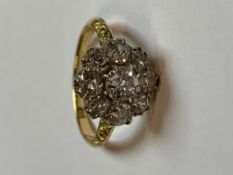 AN 18ct NINE STONE OLD CUT DIAMOND CLAW SET CLUSTER RING WITH CARVED SHOULDERS. FINGER SIZE N, WEIGH