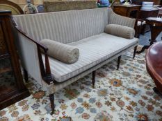 A GEO.III.MAHOGANY SHOW FRAME SQUARE BACK SETTEE ON TURNED FORELEGS WITH BRASS CASTERS. 187 x 80 x