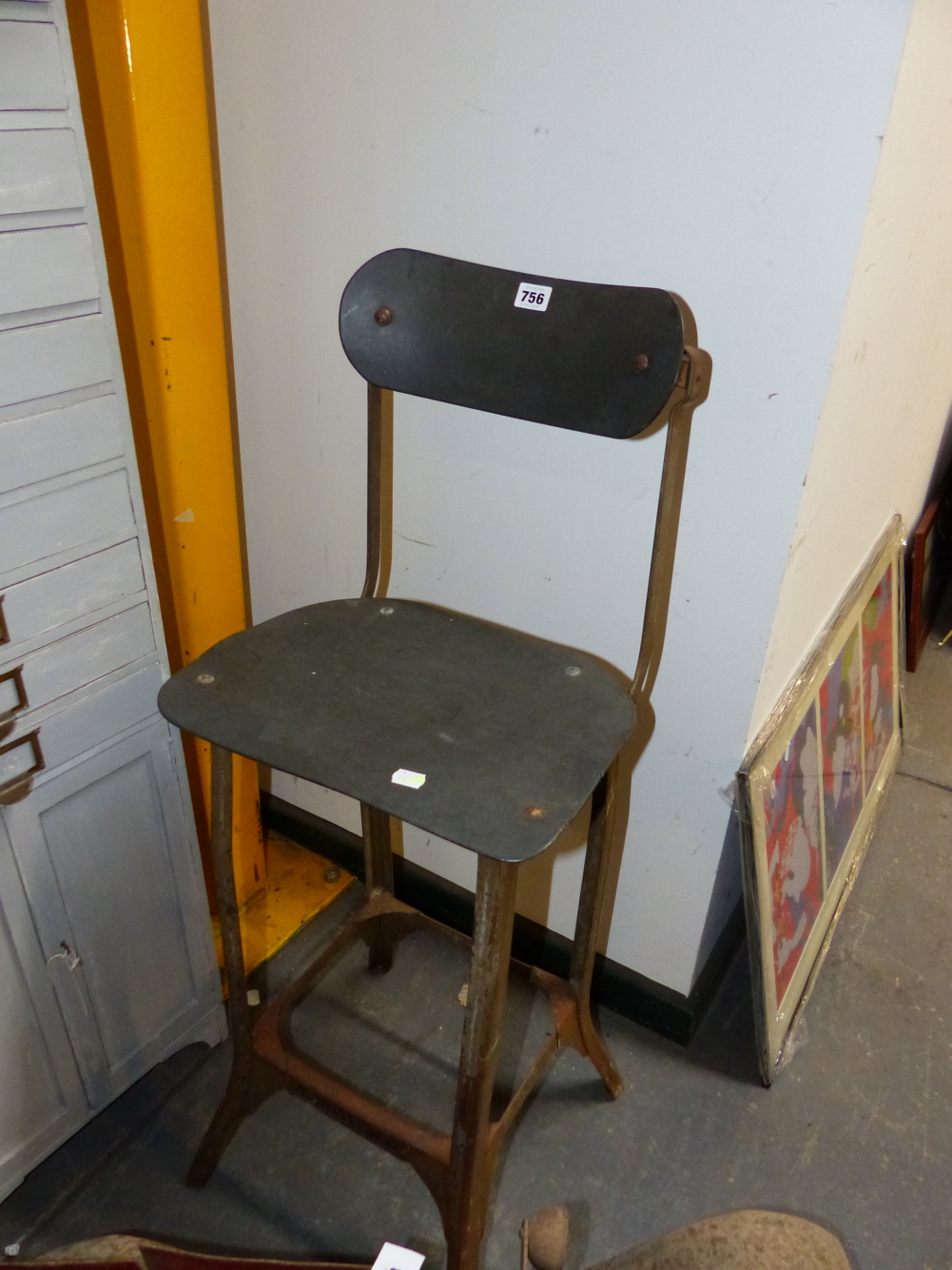 A PAINTED IRON HIGH STOOL, THE BACK WITH ADJUSTABLE TOP PANEL. THE SEAT. H.87cms.