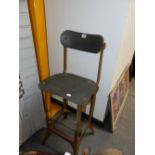 A PAINTED IRON HIGH STOOL, THE BACK WITH ADJUSTABLE TOP PANEL. THE SEAT. H.87cms.