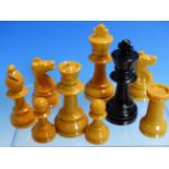 A JOHN JAQUES BOXED BROWN AND BLACK PLASTIC CHESS SET WITH CHESS BOOKLET, THE KINGS. H 7.5cms.