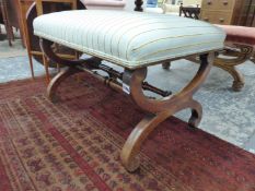 A VICTORIAN MAHOGANY STOOL, THE UPHOLSTERED SEAT ON X SCROLL LEGS JOINED BY A PAIR OF TURNED
